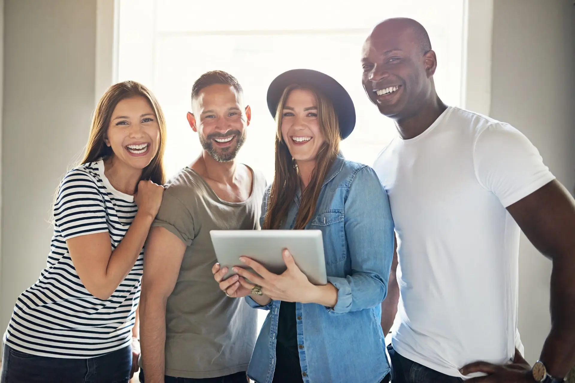 Smiling confident informal young businesspeople