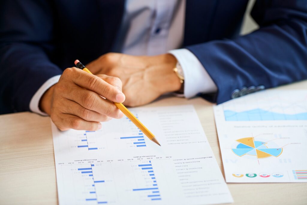 Businessman with pencil checking chart
