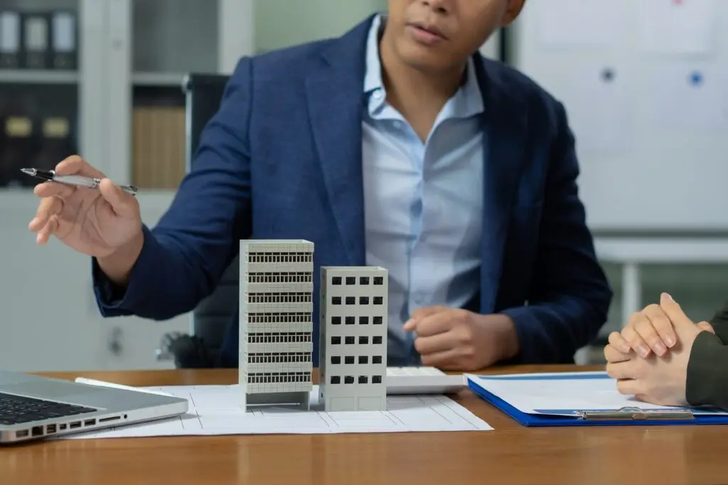 Real estate broker agent presenting and consult to customer to decision making sign insurance
